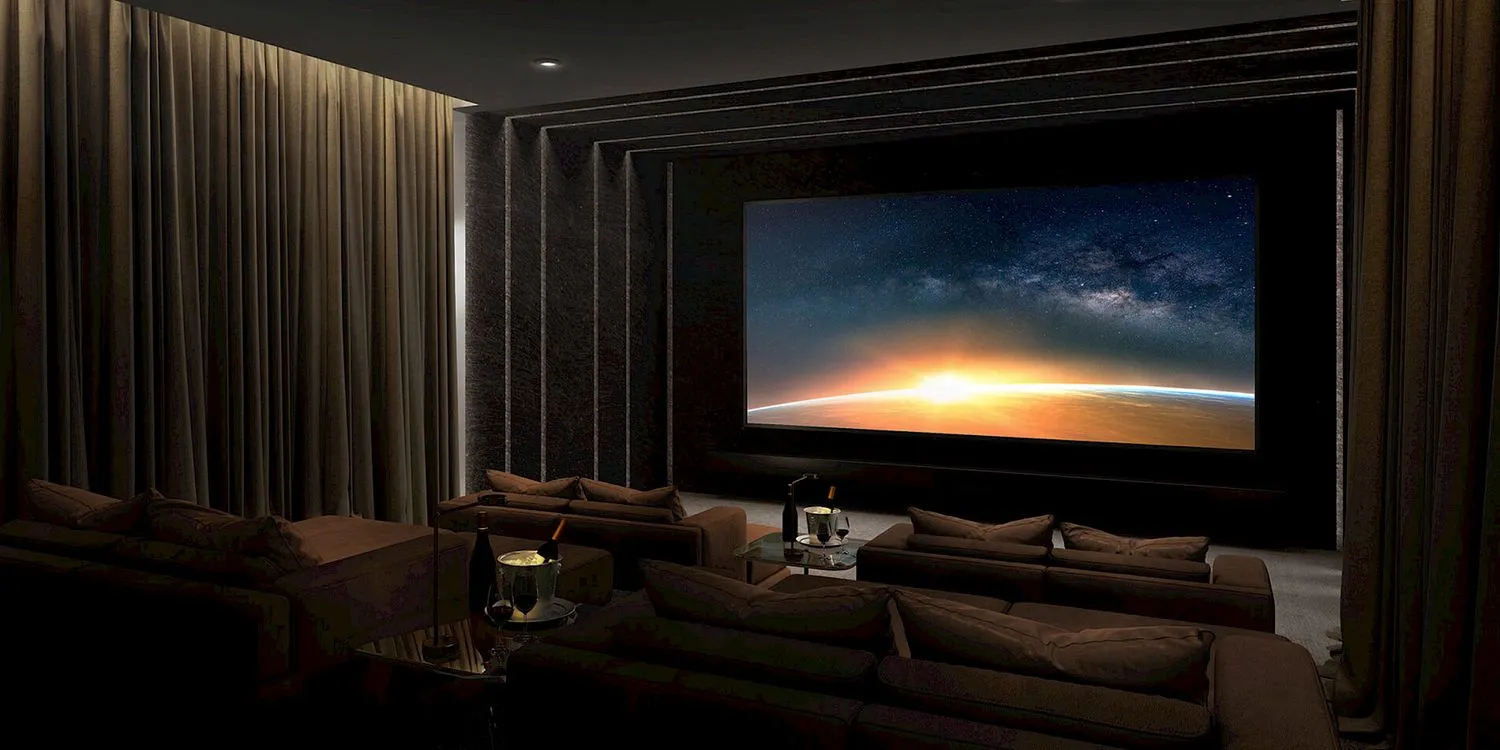 Private home cinema with reference surround sound, layered curtains and deep sofas