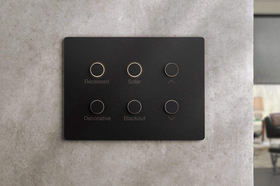 Lutron Alisse keypad with backlit engraved buttons on a polished plaster wall